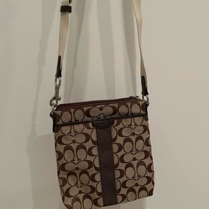 Coach crossbody.  Tan and brown with cream-colored adjustable strap